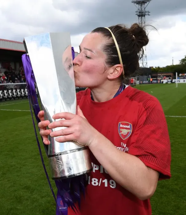 Framed Print : Arsenal Women's Historic WSL Title Win: Manager Emma Mitchell Lifts the Trophy After Defeating Manchester City