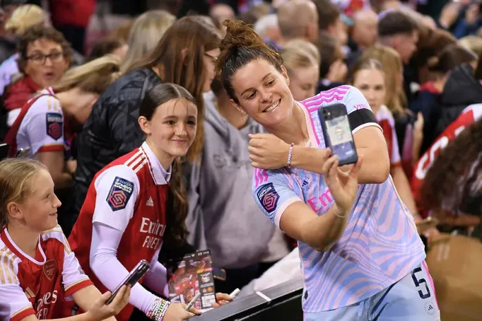 Framed Print : Arsenal Women's Players Connect with Fans: A Heartwarming Post-Match Moment at Leigh Sports Village