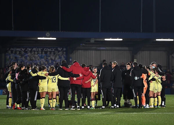 Arsenal Women's Squad Celebrates Victory with Unified Huddle after FA WSL Match against Chelsea