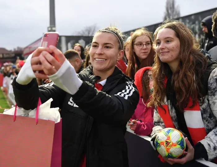 Framed Print : Arsenal Women's Steph Catley Celebrates with Fan after Triumph over Everton at Meadow Park