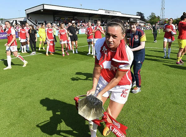 Arsenal Women's Team Celebrates Conti Cup Victory: Katie McCabe Lifts the Trophy (2022-23)