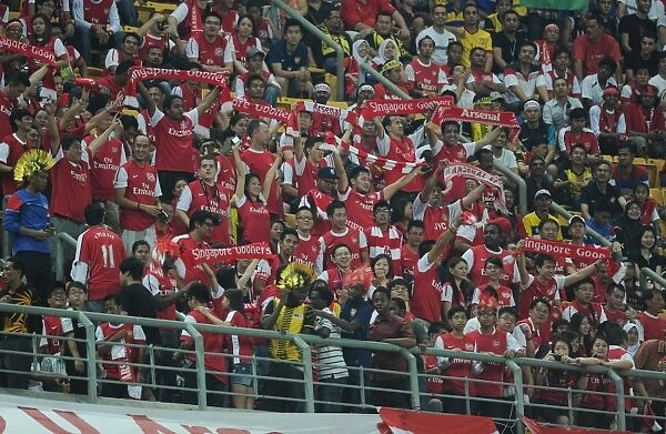 Arsenal's 4-0 Triumph over Malaysia XI: A Sea of Celebrating Fans at Bukit Jalil Stadium, 2011