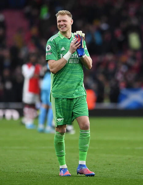 Arsenal's Aaron Ramsdale Celebrates Euphoric Victory with Ardent Fans at Emirates Stadium
