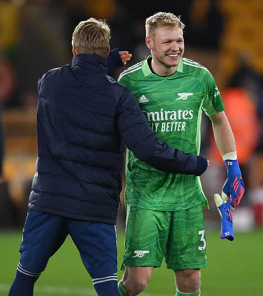 Arsenal's Aaron Ramsdale and Martin Odegaard Celebrate Victory over Wolverhampton Wanderers in Premier League