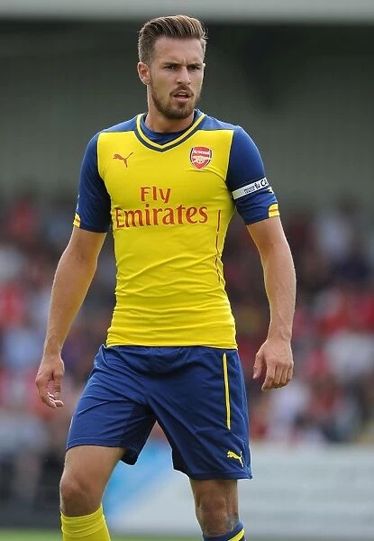 Arsenal's Aaron Ramsey in Action: A Thrilling Pre-Season Clash at Boreham Wood