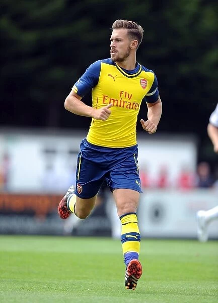 Arsenal's Aaron Ramsey in Action: A Thrilling Pre-Season Clash against Boreham Wood