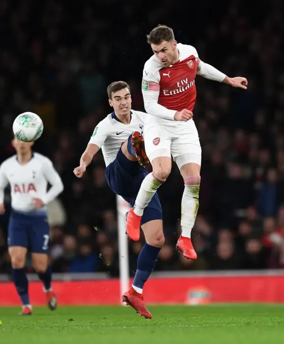 Framed Print : Arsenal's Aaron Ramsey Battles with Tottenham's Harry Winks in Carabao Cup Quarterfinal Showdown