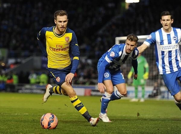 Arsenal's Aaron Ramsey Breaks Past Brighton's Defense in FA Cup Clash