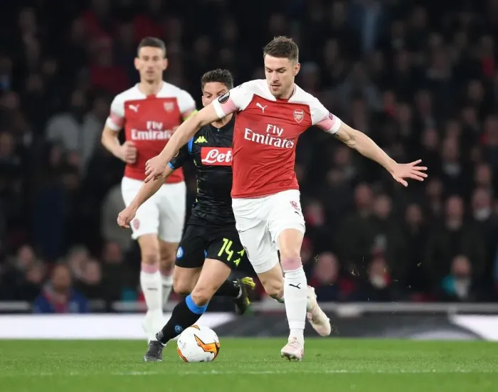 Framed Print : Arsenal's Aaron Ramsey Breaks Past Napoli's Dries Mertens in Europa League Quarterfinal Clash Framed Print : Arsenal's Aaron Ramsey Breaks Past Napoli's Dries Mertens in Europa League Quarterfinal Clash