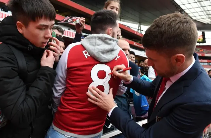 Framed Print : Arsenal's Aaron Ramsey Celebrates with Fans after Securing Victory over Brighton & Hove Albion