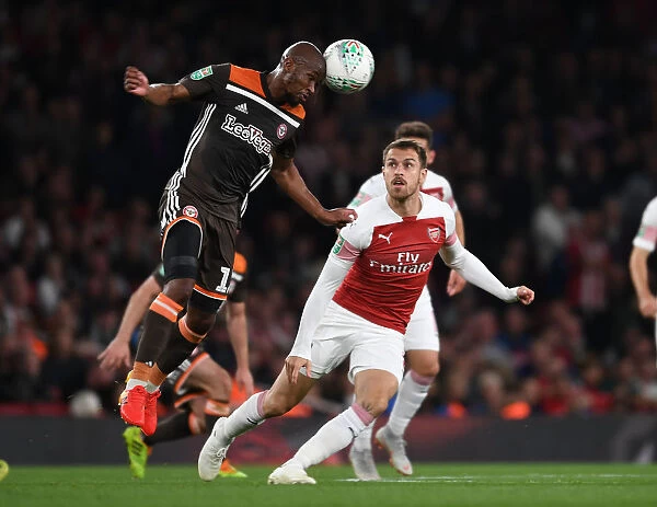 Arsenal's Aaron Ramsey Clashes with Brentford's Kamohelo Mokotjo in Carabao Cup Showdown