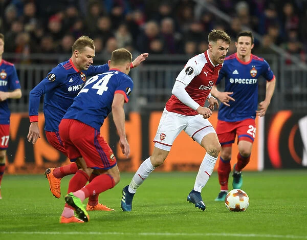 Arsenal's Aaron Ramsey Clashes with CSKA Moscow's Vasili Berezutski in Europa League Quarterfinal