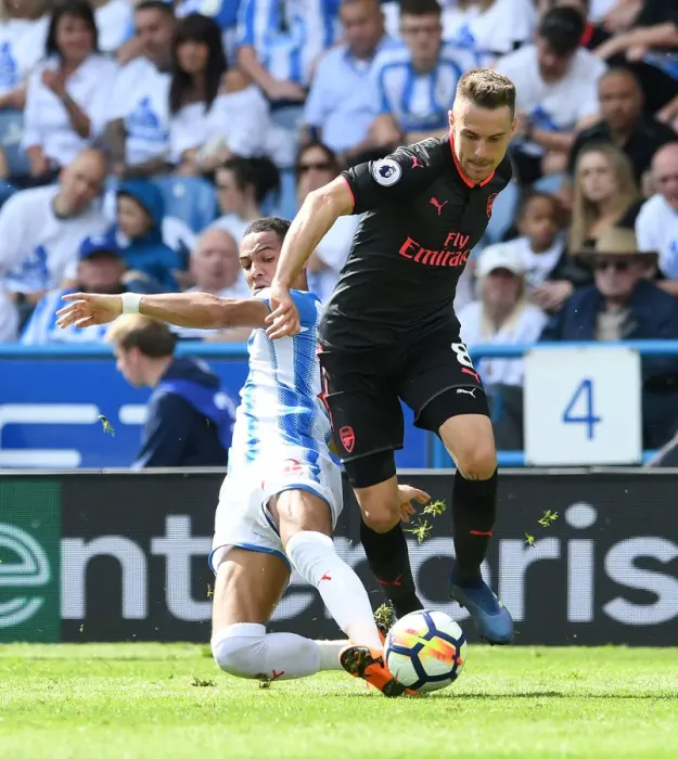 Framed Print : Arsenal's Aaron Ramsey Clashes with Huddersfield's Tom Ince in Premier League Showdown Framed Print : Arsenal's Aaron Ramsey Clashes with Huddersfield's Tom Ince in Premier League Showdown