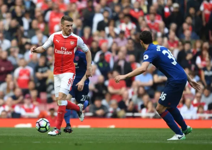 Framed Print : Arsenal's Aaron Ramsey Clashes with Manchester United's Matteo Darmian in Premier League Showdown Framed Print : Arsenal's Aaron Ramsey Clashes with Manchester United's Matteo Darmian in Premier League Showdown