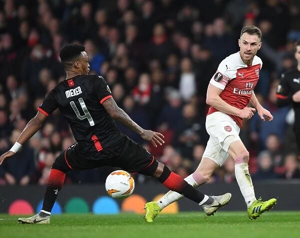 Arsenal's Aaron Ramsey Clashes with Mexer in Europa League Battle