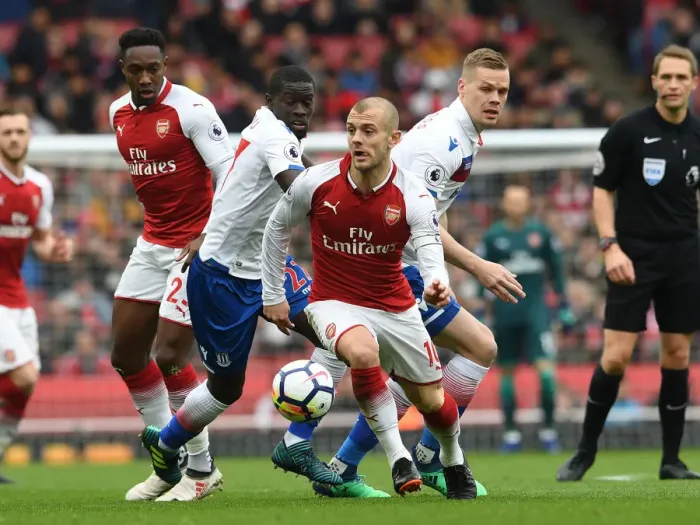 Framed Print : Arsenal's Aaron Ramsey Clashes with Stoke's Badou Ndiaye and Ryan Shawcross