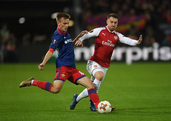 Arsenal's Aaron Ramsey Closes Down CSKA Moscow's Konstantin Kuchaev in Europa League Quarterfinal