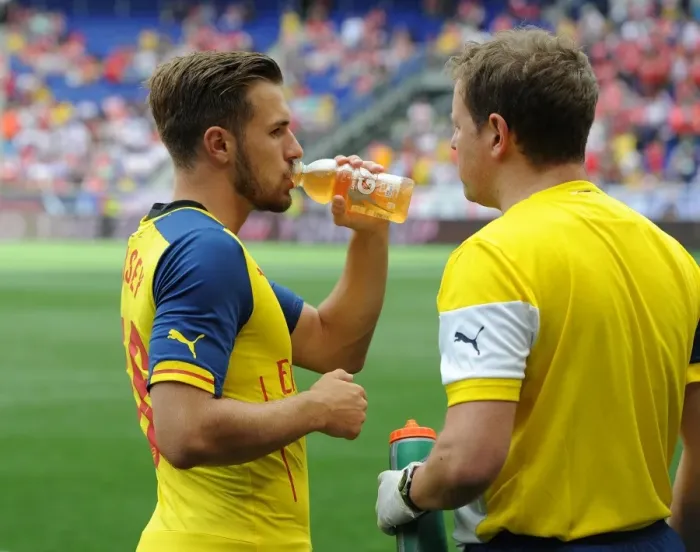 Framed Print : Arsenal's Aaron Ramsey Consults Team Physio Colin Lewin Before New York Red Bulls Clash Framed Print : Arsenal's Aaron Ramsey Consults Team Physio Colin Lewin Before New York Red Bulls Clash