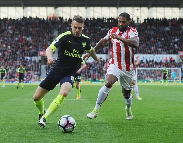 Arsenal's Aaron Ramsey Dashes Past Stoke's Glenn Johnson