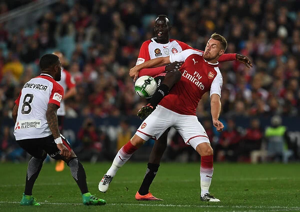 Arsenal's Aaron Ramsey Faces Off Against Abraham Majok and Roly Bonevacia in Sydney Clash