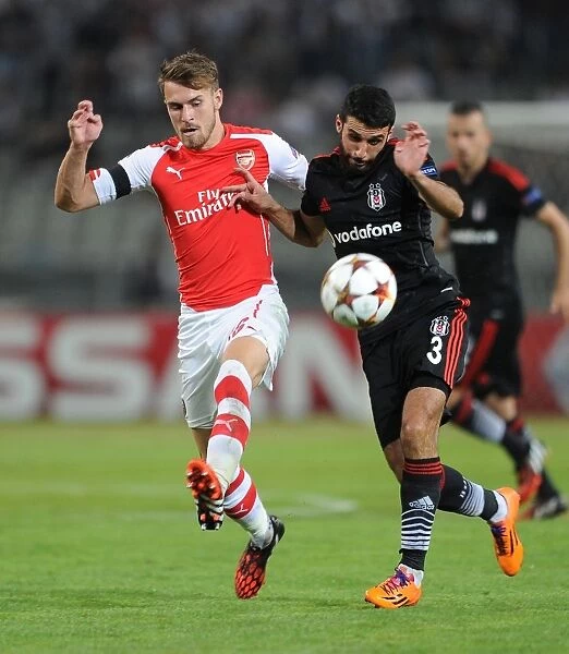 Arsenal's Aaron Ramsey Faces Off Against Besiktas Ismail Koybasi in UEFA Champions League Qualifier