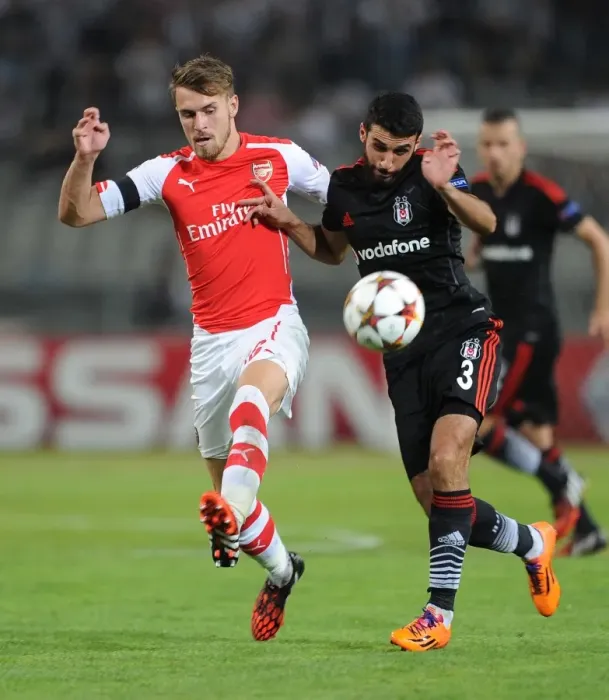 Framed Print : Arsenal's Aaron Ramsey Faces Off Against Besiktas Ismail Koybasi in UEFA Champions League Qualifier Framed Print : Arsenal's Aaron Ramsey Faces Off Against Besiktas Ismail Koybasi in UEFA Champions League Qualifier