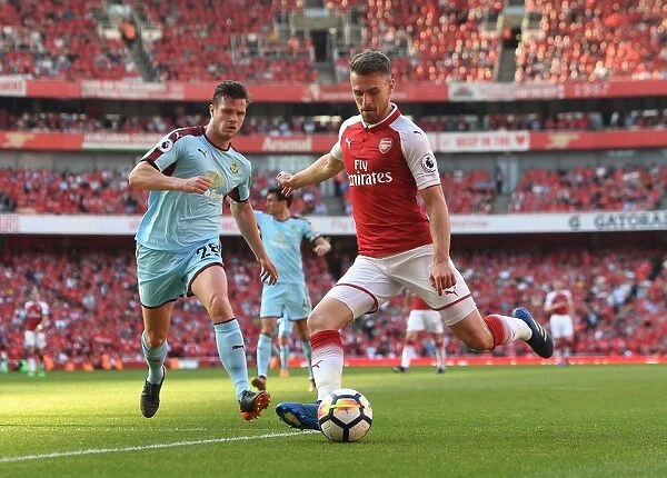 Arsenal's Aaron Ramsey Faces Off Against Burnley's Kevin Long in Intense Premier League Clash