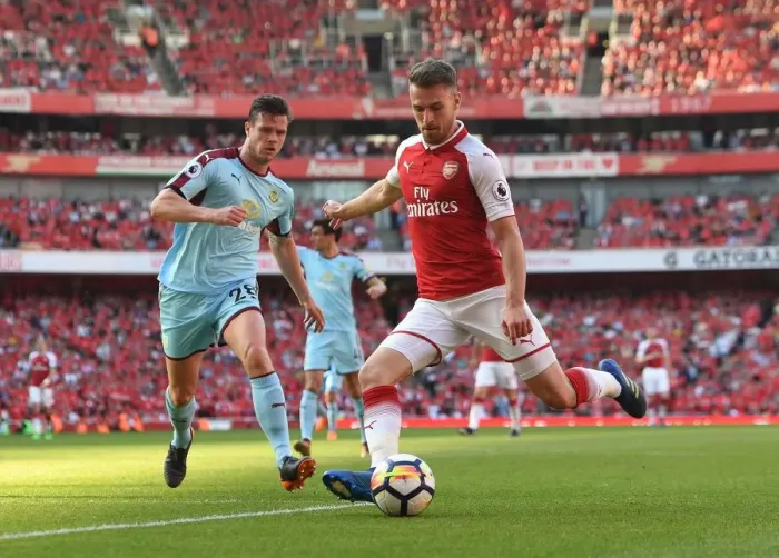 Framed Print : Arsenal's Aaron Ramsey Faces Off Against Burnley's Kevin Long in Intense Premier League Clash Framed Print : Arsenal's Aaron Ramsey Faces Off Against Burnley's Kevin Long in Intense Premier League Clash