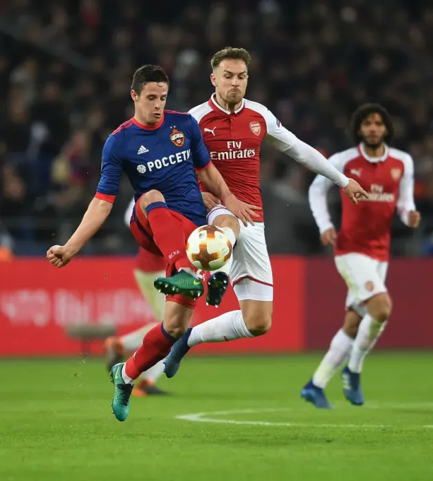 Framed Print : Arsenal's Aaron Ramsey Faces Off Against CSKA Moscow's Kristijan Bistrovic in Europa League Quarterfinal