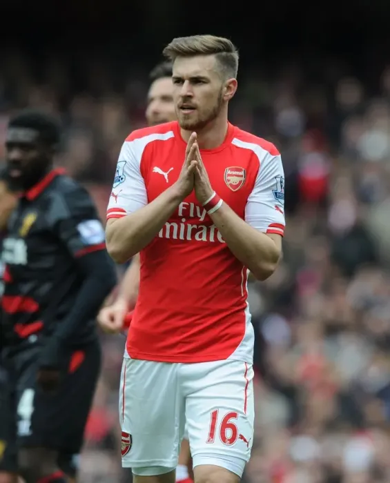 Framed Print : Arsenal's Aaron Ramsey Faces Off Against Liverpool in the Premier League 2014-15