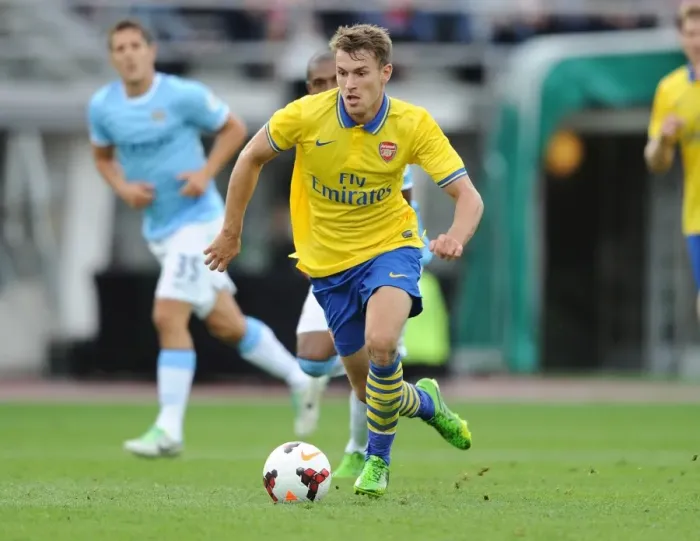Framed Print : Arsenal's Aaron Ramsey Faces Off Against Manchester City in 2013 Pre-Season Clash
