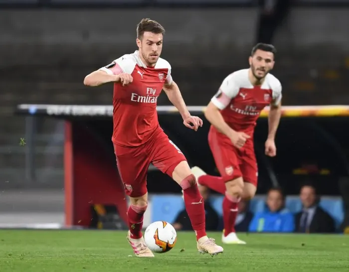 Framed Print : Arsenal's Aaron Ramsey Faces Off Against Napoli in Europa League Quarterfinals