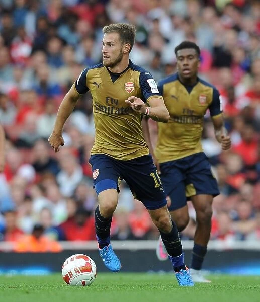 Arsenal's Aaron Ramsey Faces Off Against Olympique Lyonnais at the Emirates Cup