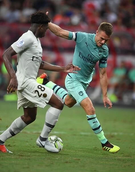 Arsenal's Aaron Ramsey Faces Off Against PSG's Loic Mbe Soh in 2018 International Champions Cup