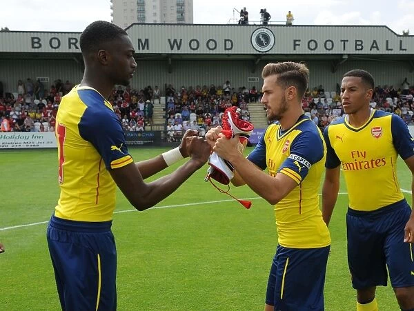 Arsenal's Aaron Ramsey Faces Off Against Semi Ajayi of Boreham Wood in Pre-Season Friendly