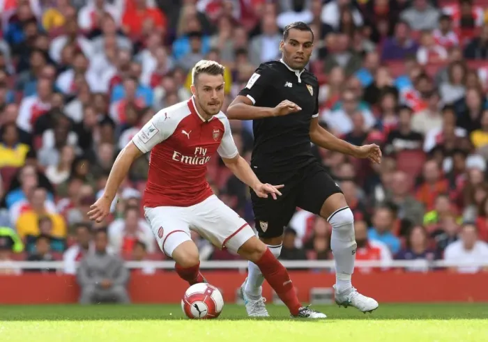 Framed Print : Arsenal's Aaron Ramsey Faces Off Against Sevilla's Gabriel Mercado in Emirates Cup Clash