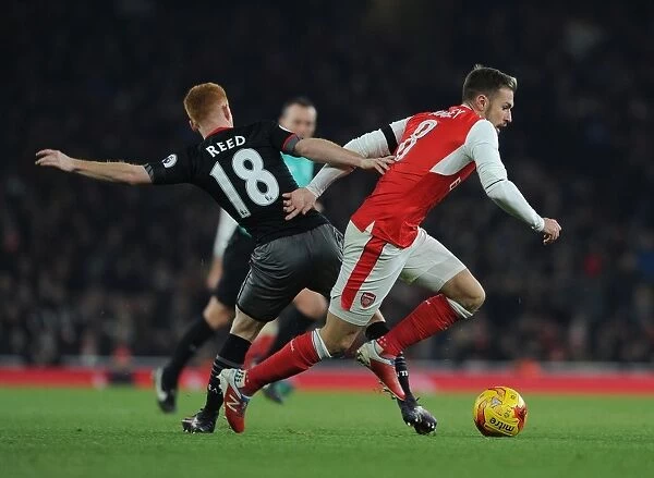 Arsenal's Aaron Ramsey Faces Off Against Southampton's Harrison Reed in EFL Cup Clash