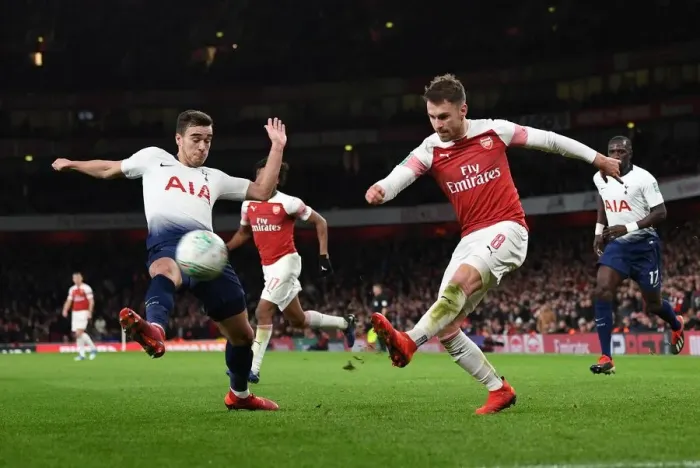 Framed Print : Arsenal's Aaron Ramsey Faces Off Against Tottenham's Harry Winks in Carabao Cup Quarterfinal Showdown Framed Print : Arsenal's Aaron Ramsey Faces Off Against Tottenham's Harry Winks in Carabao Cup Quarterfinal Showdown