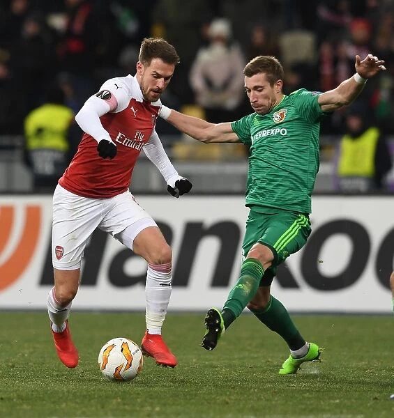 Arsenal's Aaron Ramsey Faces Off Against Vorskla's Lurii Kolomoets in Europa League Clash