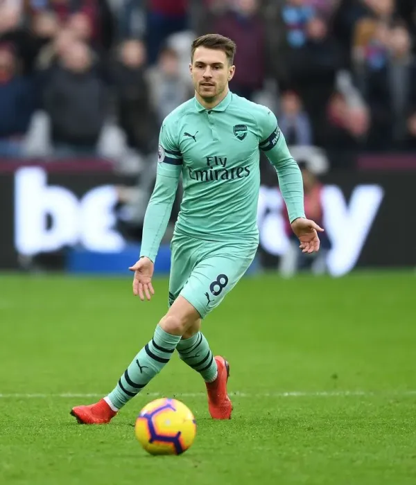 Framed Print : Arsenal's Aaron Ramsey Faces Off Against West Ham in Premier League Clash