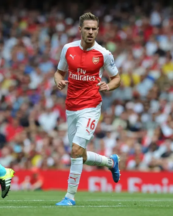 Framed Print : Arsenal's Aaron Ramsey Faces Off Against West Ham United in Intense 2015-16 Premier League Clash