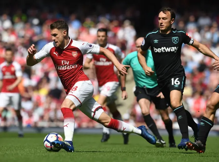 Framed Print : Arsenal's Aaron Ramsey Faces Off Against West Ham's Mark Noble in Premier League Clash