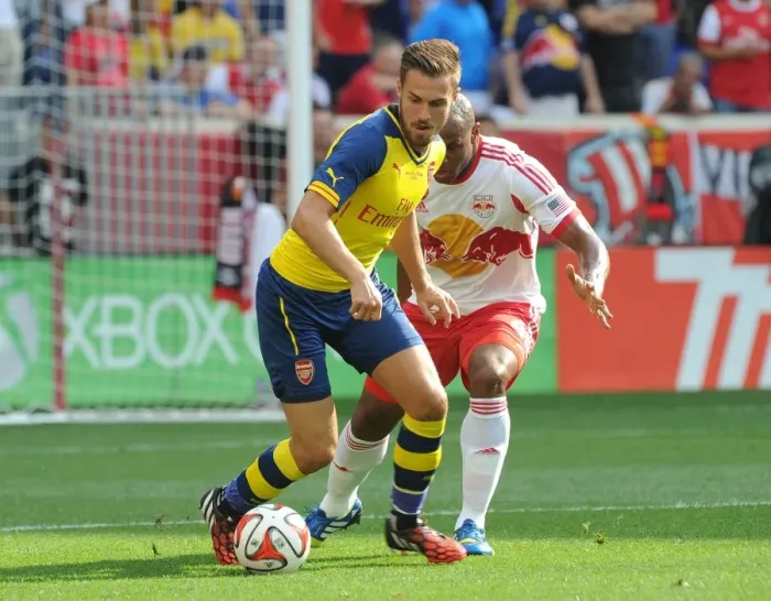 Framed Print : Arsenal's Aaron Ramsey Fends Off Jamison Olave in 2014 Pre-Season Clash Framed Print : Arsenal's Aaron Ramsey Fends Off Jamison Olave in 2014 Pre-Season Clash