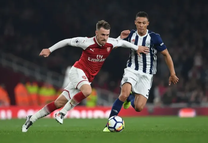 Framed Print : Arsenal's Aaron Ramsey Fends Off Kieran Gibbs in Intense Clash with West Bromwich Albion Framed Print : Arsenal's Aaron Ramsey Fends Off Kieran Gibbs in Intense Clash with West Bromwich Albion
