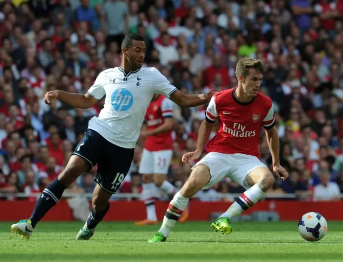 Framed Print : Arsenal's Aaron Ramsey Fends Off Tottenham's Mousa Dembele in Intense Premier League Clash
