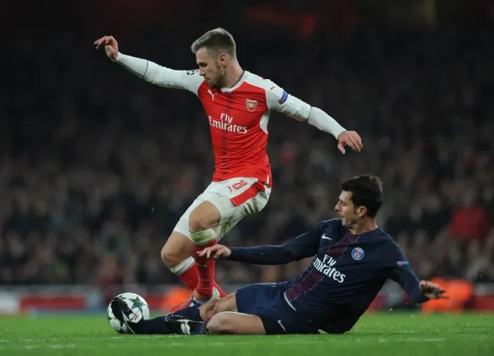 Framed Print : Arsenal's Aaron Ramsey Fouled by Thiago Motta in 2016-17 Champions League Match
