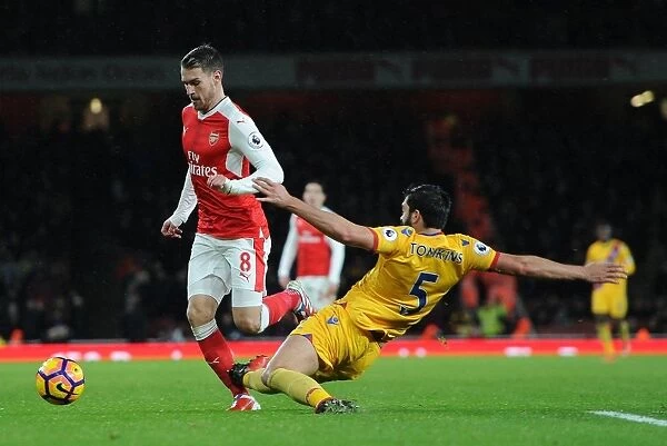 Arsenal's Aaron Ramsey Fouls by Crystal Palace's James Tomkins in Premier League Clash