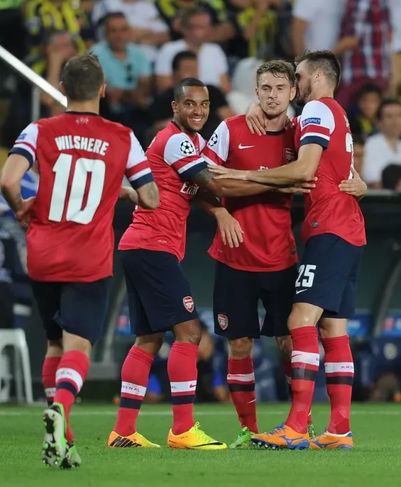 Framed Print : Arsenal's Aaron Ramsey, Jack Wilshere, Theo Walcott and Carl Jenkinson Celebrate Goals Against Fenerbahce in UEFA Champions League Play-offs Framed Print : Arsenal's Aaron Ramsey, Jack Wilshere, Theo Walcott and Carl Jenkinson Celebrate Goals Against Fenerbahce in UEFA Champions League Play-offs