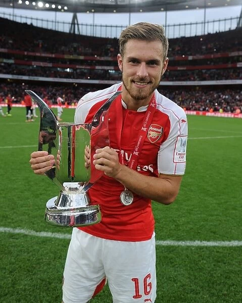 Arsenal's Aaron Ramsey Lifts Emirates Cup after Victory over VfL Wolfsburg