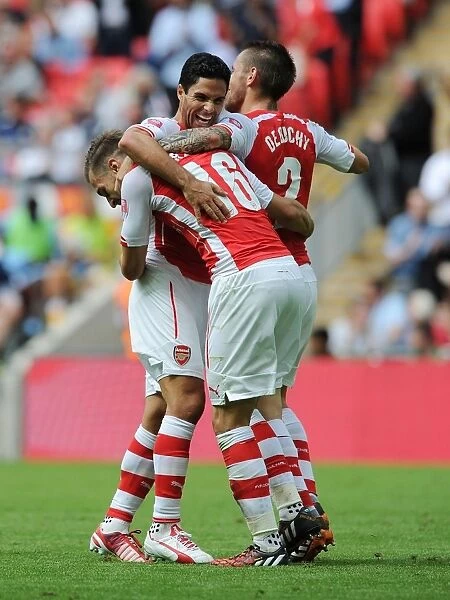 Arsenal's Aaron Ramsey, Mathieu Debuchy, and Mikel Arteta Celebrate Goals Against Manchester City in FA Community Shield 2014 / 15